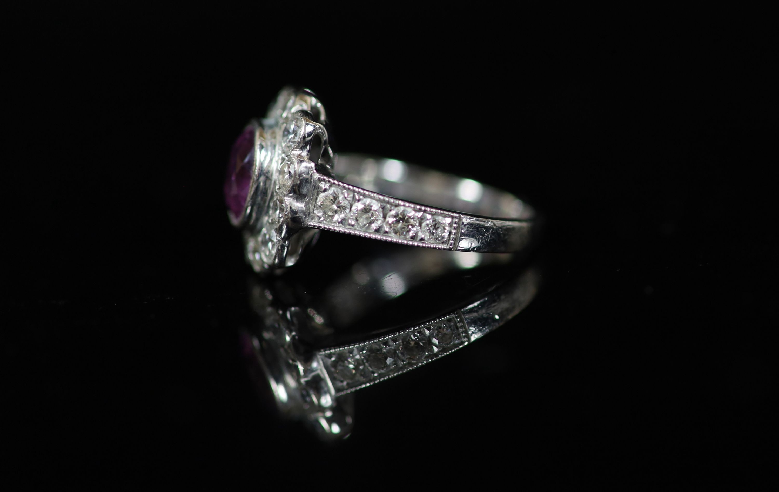 A modern 18ct white gold, pink sapphire and diamond cluster ring